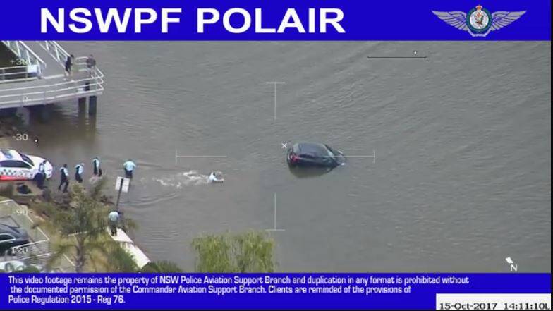 Six police waded into the water to rescue the woman. Photo: NSW Police Force Facebook