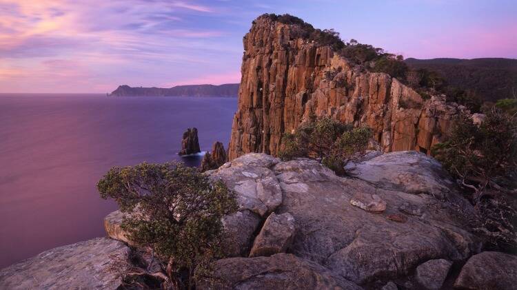 The Cape Huay Track leads to rugged coastal cliffs.  Photo: Getty Images