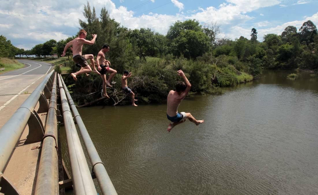 A bunch of locals take a dip in the Nepean River near Camden Airport earlier this week. Picture: Simon Bennett