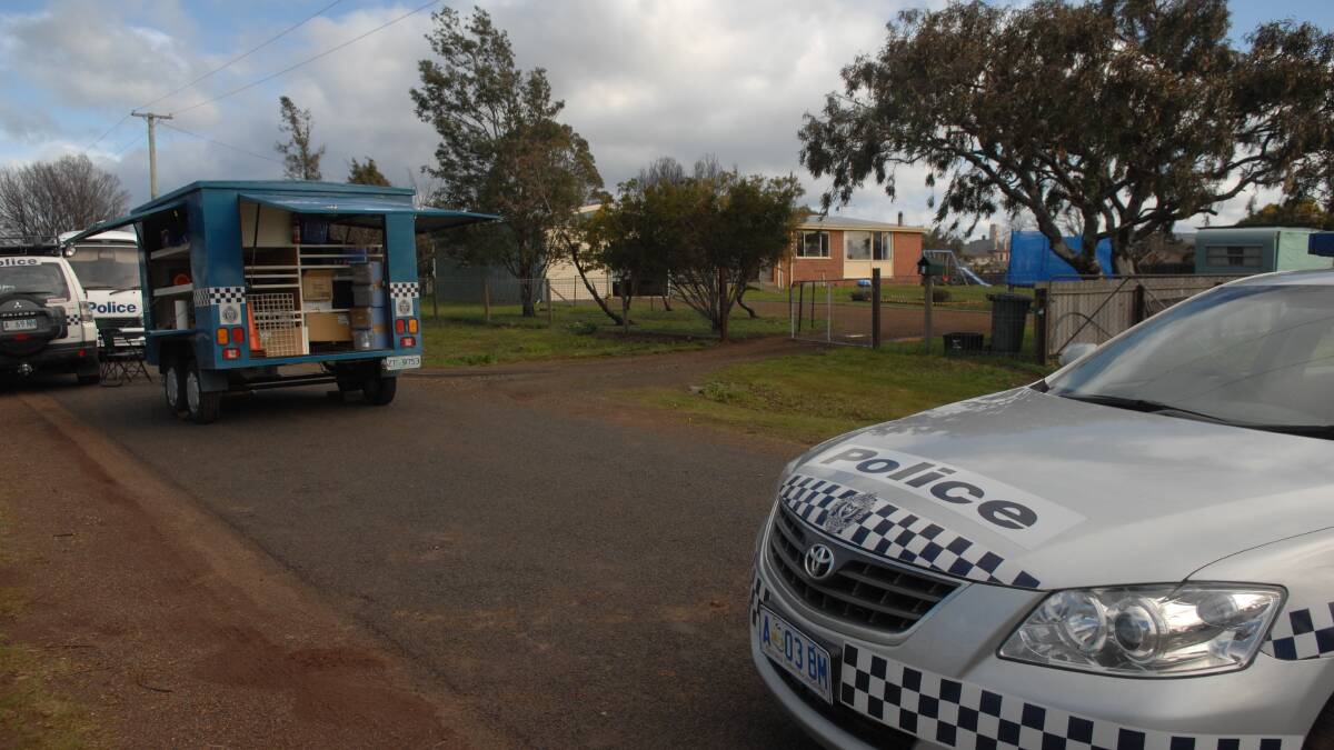 Tasmania Police and forensic crews at the scene of Shane Barker's murder at Campbell Town in 2009.