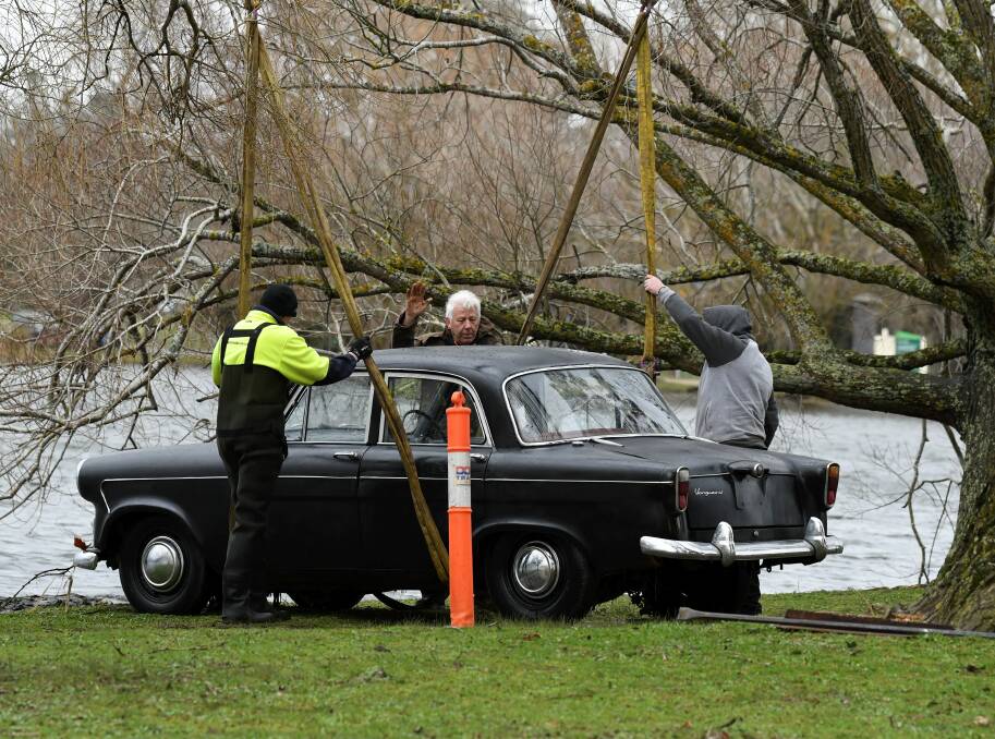 FILMING: Production crew ready a car for a watery end in Lake Wendouree during filming of the final telemovie of the Doctor Blake Mysteries. Picture: Lachlan Bence