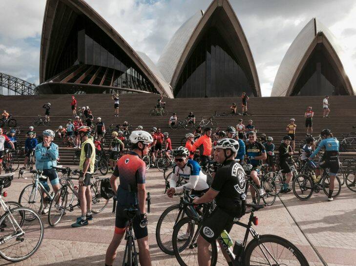Riders at the Sydney Opera House as they take part in a memorial ride to celebrate the British Endurance Cycling legend Mike Hall, who tragically died on Friday during the Indian Pacific Wheel Race. 2 April 2017. Photo James Brickwood Photo: James Brickwood