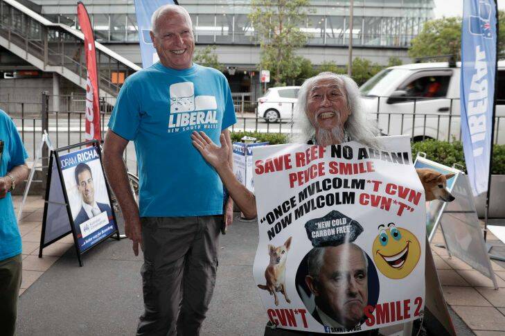 Jim Molan meets with Danny Lim at a pre-poll booth in Epping, during the Bennelong by-election on Friday 15 December 2017. fedpol Photo: Alex Ellinghausen