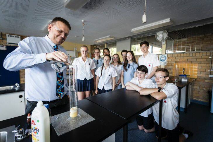 Brett McKay, a science teacher who is going to receive the PM's prize for excellence in science teaching in secondary schools?? is pictured at Kirrawee High School with students on 16 October, 2017.  Photo: Brook Mitchell
