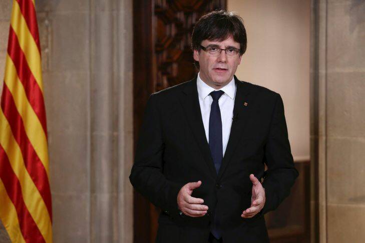 Catalan President Carles Puigdemont speaks during a statement at the Palau Generalitat in Barcelona, Spain, on Wednesday, Oct. 4, 2017. Catalonia's regional president, Carles Puigdemont, is addressing regional lawmakers on Monday to review a referendum won by supporters of independence from Spain on Oct. 1. (Jordi Bedmar/Presidency Press Service, Pool Photo via AP)