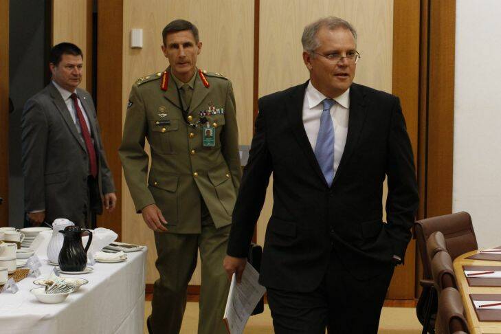 Scott Morrison minister for Immigration and Border Protection appeared before a Senate Committee hearing with Joint Agency Taskforce Lieutenant General Angus Campbell and Department Secretary Martin Bowles at Parliament House in Canberra on Friday 31 January 2014 Photo: Andrew Meares