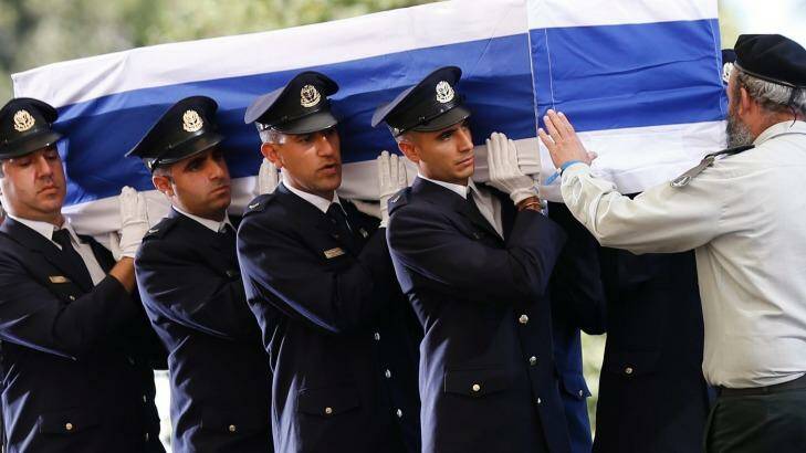 Knesset guards carry the flag-draped coffin during the funeral of former Israeli President Shimon Peres at the Mount Herzel national cemetery in Jerusalem. Photo: Ariel Schalit
