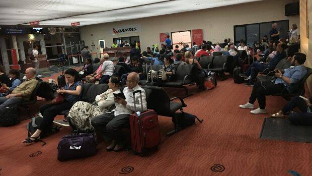 Passengers wait at Alice Springs Airport while overnight accommodation is arranged. Photo: Sanjeev Pandey
