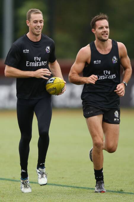 Nathan Brown, right, trains with Collingwood then captain Nick Maxwell. Getty images.