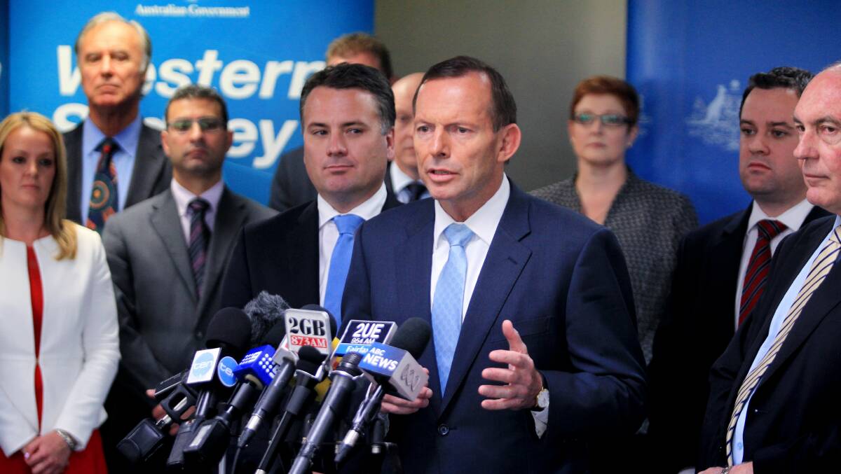 Prime Minister Tony Abbott announcing the roads funding package to support the airport proposed for Badgerys Creek. Picture: Wesley Lonergan