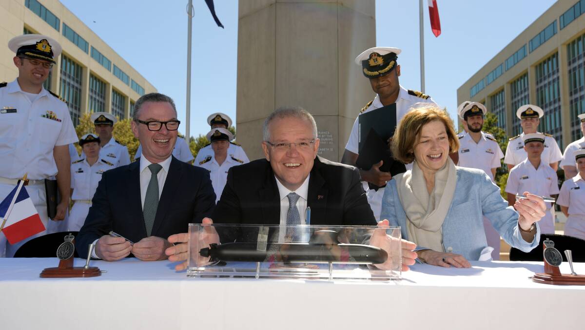 Former defence minister Christopher Pyne and Prime Minister Scott Morrison sign a $50-billion Strategic Partnership Agreement with France in February to build new submarines for the Royal Australian Navy. Picture: Getty Images