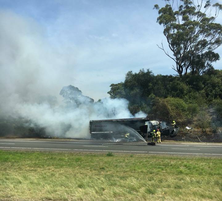 A truck caught fire following a crash on the Hume Highway near Menangle Park on Tuesday. Picture: Stewart Peters