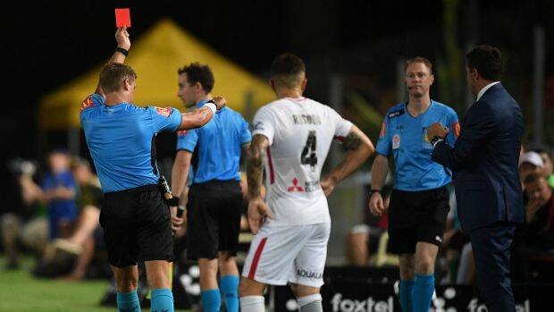 What a VARce: Western Sydney Wanderers' Josh Risdon looks on in disbelief as another red card is brandished on Saturday night. Photo: AAP