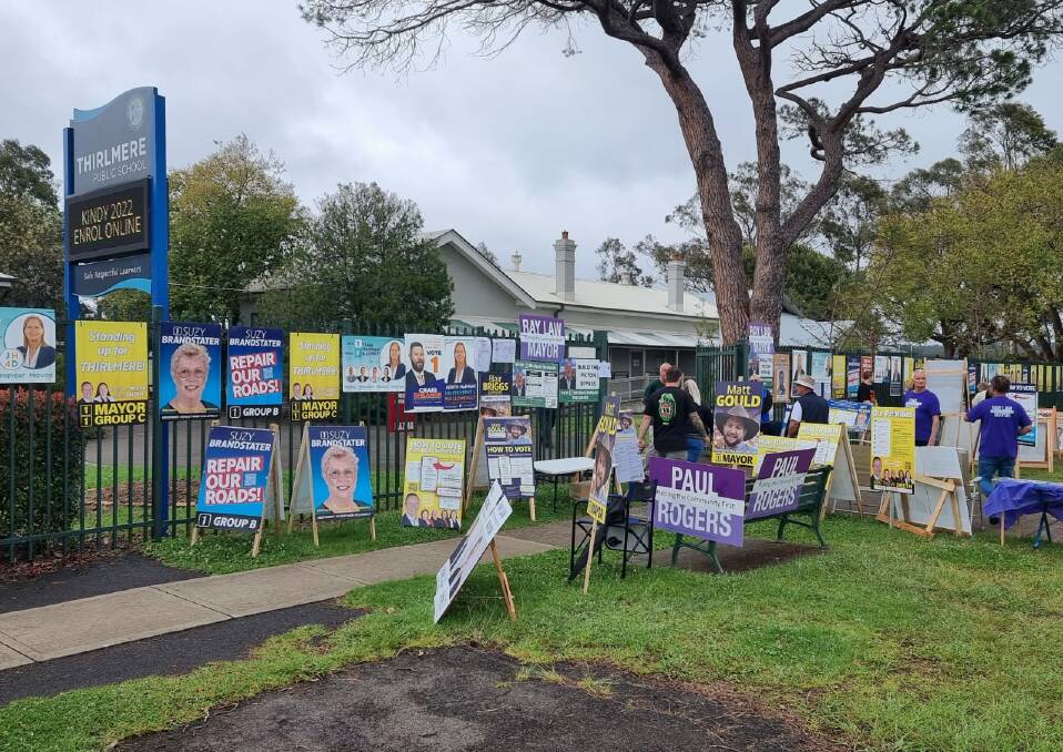 Voting day: Volunteers set up outside Thirlmere Public School on election day, Saturday, December 4. Picture: Allan Henson