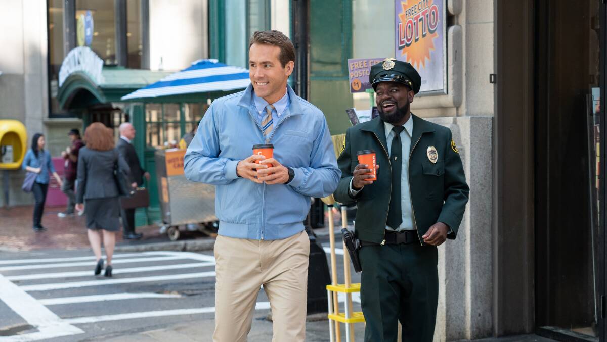 Feeling free: Ryan Reynolds and Lil Rey Howery star as non-player video game characters in the fun new action comedy Free Guy, rated M, now in cinemas, streaming and on DVD and blu-ray. Picture: 20th Century Studios