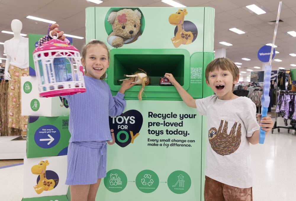 Harriet Soper, 9, and Jack Soper, 5, donate their kids to the TerraCycle station at Big W. Picture: Supplied