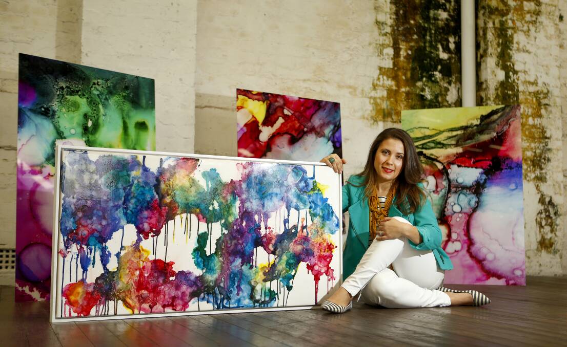 Bright display: Celeste Wrona poses for a picture with her artwork ahead of 'The Other Art Fair'. Photo: Daniel Munoz