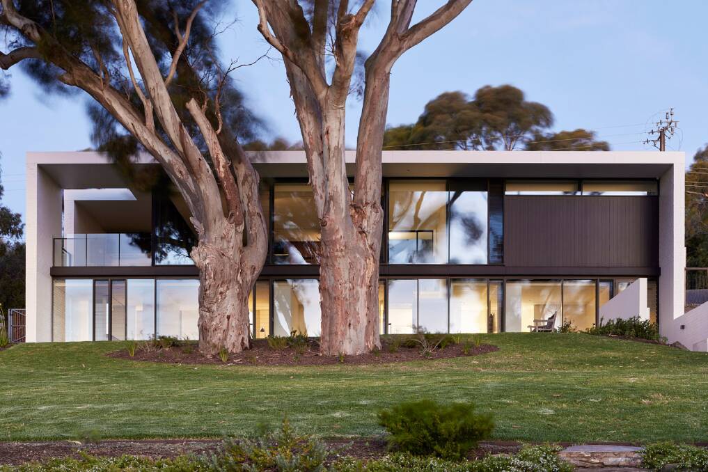 Nestled above the picturesque McLaren Vale wine region in South Australia, the award-winning Sugar Gum House designed by Architects Ink has a sculptural simplicity that embraces sustainable living. Pictures: Sam Noonan.