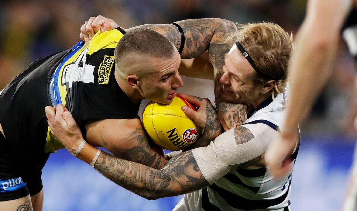 Geelong's Tom Stewart takes on Tiger Dustin Martin in their June 25 clash. Stewart was suspended for four weeks for a crude hit on Richmond midfielder Dion Prestia, making him ineligible for this year's Brownlow Medal. Pictures: Getty Images