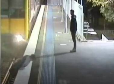 The young man flings himself on to the platform. Picture: 9 News