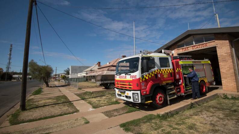 Rod Barclay tends to a NSW Fire & Rescue tanker at Warren's fire station.