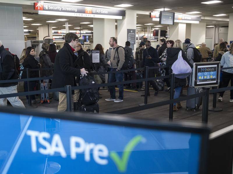 The TSA is among agencies affected by the US government shutdown, slowing checks at airports.