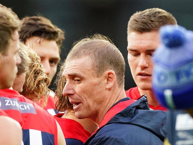 Coach Simon Goodwin (c) says critics will not affect Melbourne as they look to rediscover AFL form.