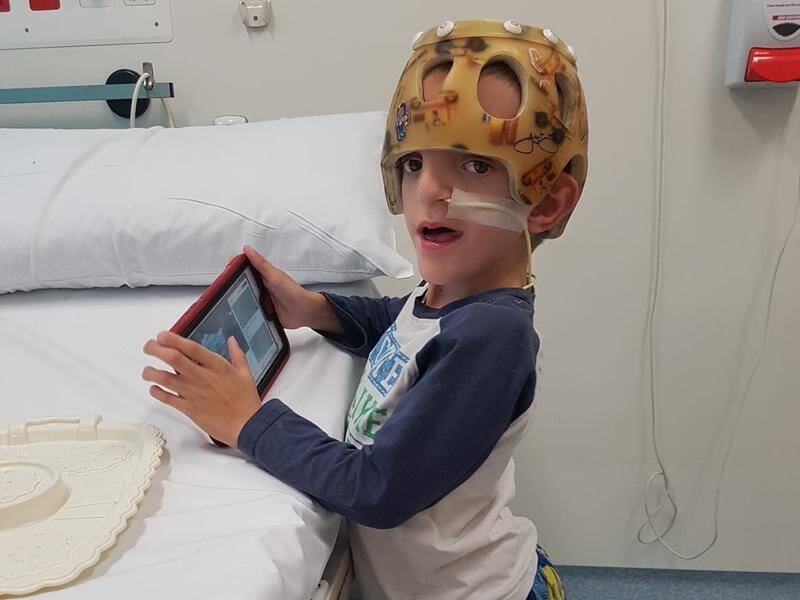 Young Queensland boy Zayviar Mullins has a brain condition suffered by just seven people worldwide.