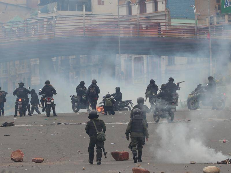 Police clash with demonstrators during protests in La Paz, Bolivia .