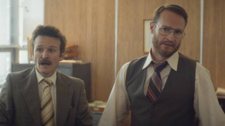 a still from a film called The Eleven O'Clock starring Damon Herriman (left) and Josh Lawson. No photographer credit.