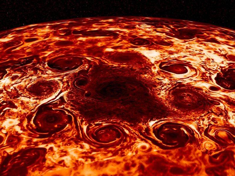Geometric clusters of powerful cyclones rage at Jupiter's poles, NASA observations show.