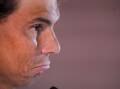 Rafael Nadal, speaking at the Madrid Open, is not sure he'll be fit to play the French Open. (AP PHOTO)
