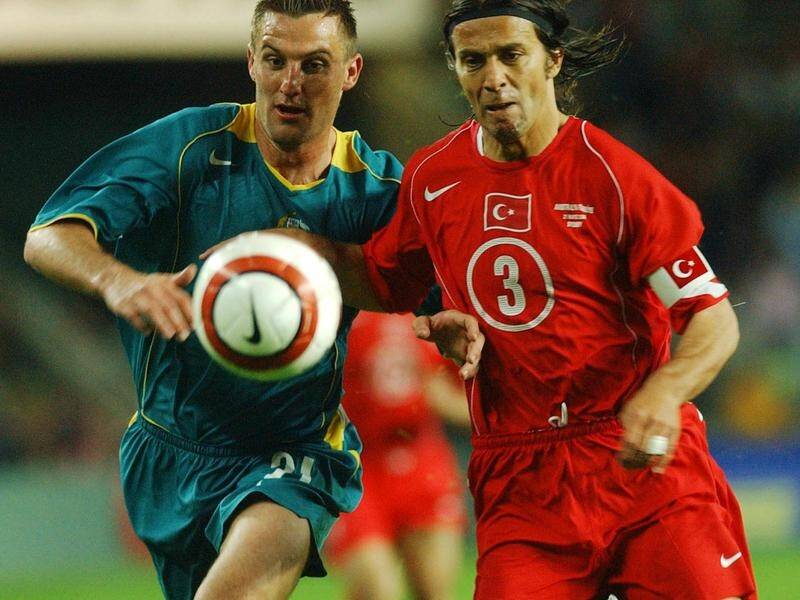 Chicago Fire assistant coach David Zdrilic (l) in action for the Socceroos against Turkey in 2004.