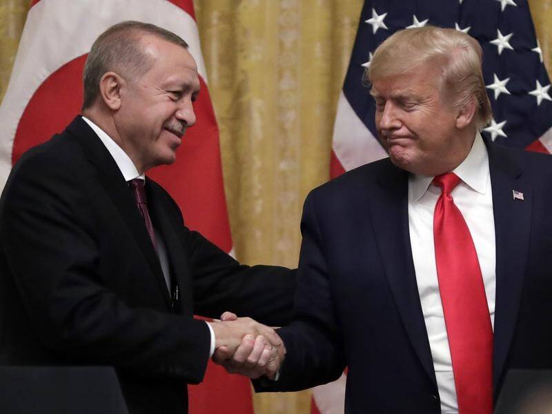 President Donald Trump shakes hands with Turkish President Recep Tayyip Erdogan at the White House.