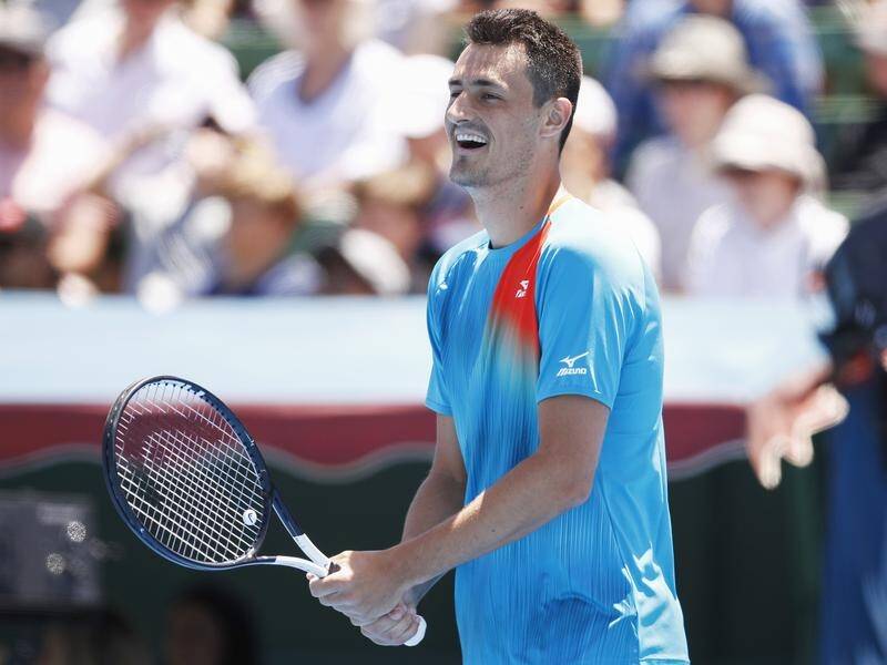Bernard Tomic will be among 14 locals in first-day action at the Australian Open in Melbourne.