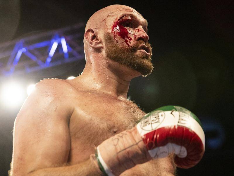 A bloodied Tyson Fury has beaten Otto Wallin on points in their heavyweight bout in Las Vegas.