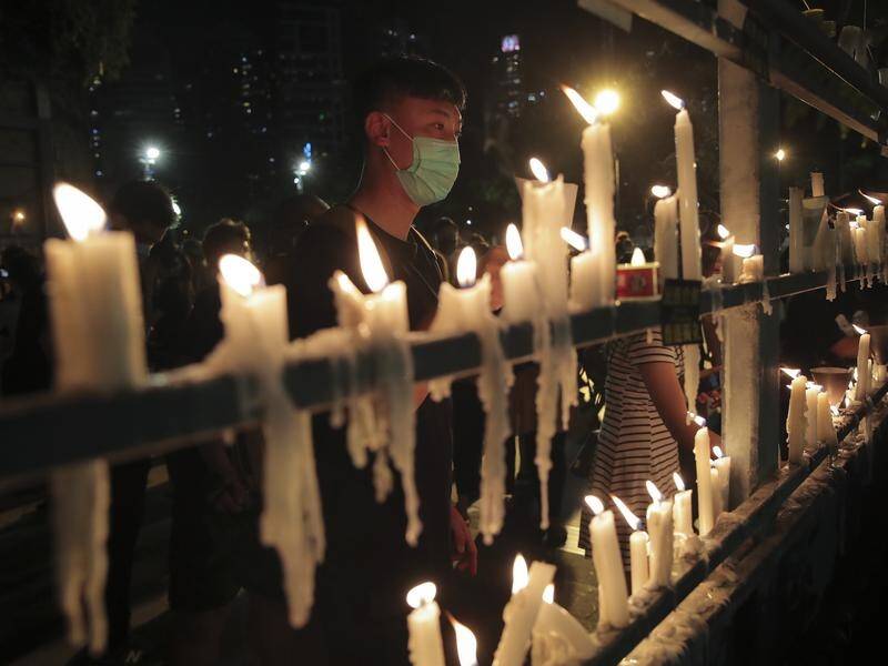 Nine Hong Kong activists have been jailed for taking part in a vigil for Tiananmen Square victims.