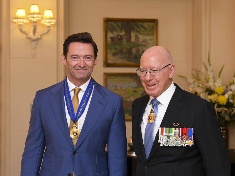 Hugh Jackman has received his AC medal at Government House from Governor-General David Hurley.