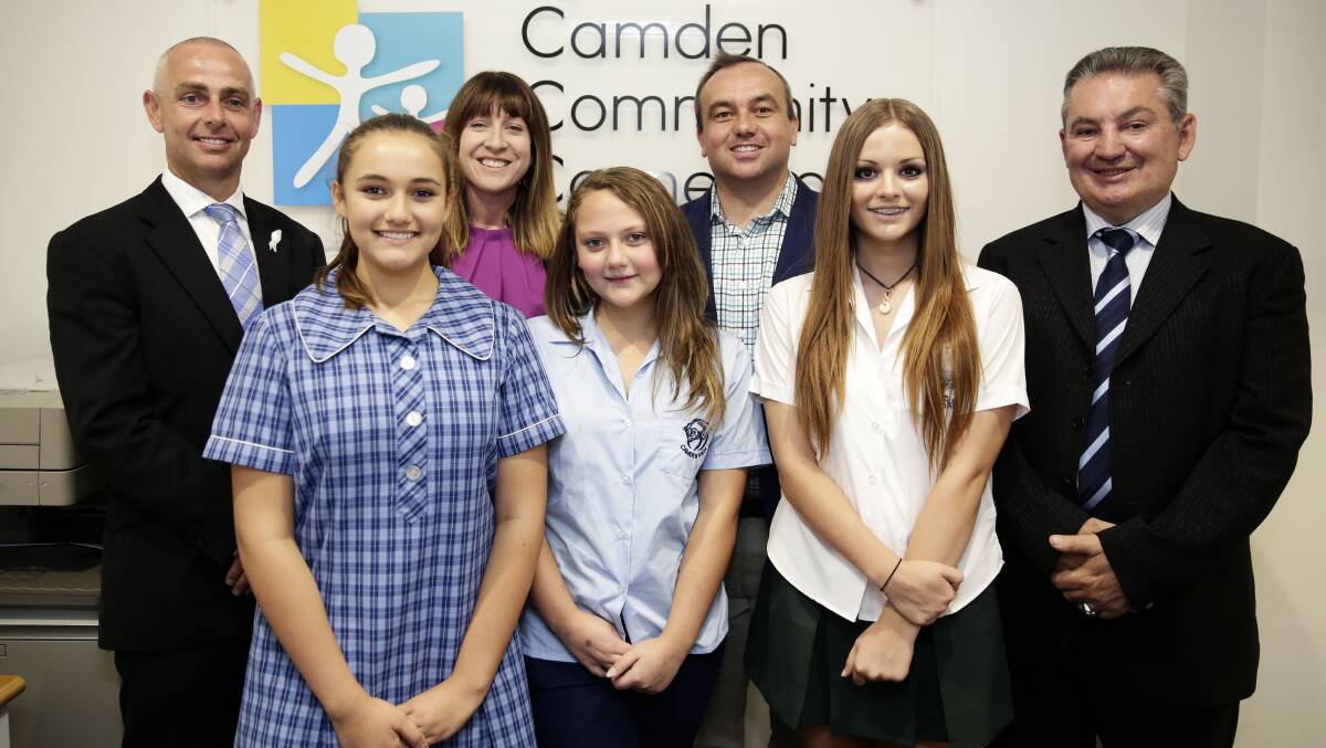 Health service boost: Camden MP Chris Patterson, Youth Action NSW managing director Katie Acheson, Wollondilly MP Jai Rowell and Macarthur MP Russell Matheson with students Bree Cornish, 16, from Mount Annan High School, Danielle Rose, 14, from Camden High School, and Elle Morrish, 14, from Camden High School, who reccently completed a girls group program. Picture: Anna Warr
