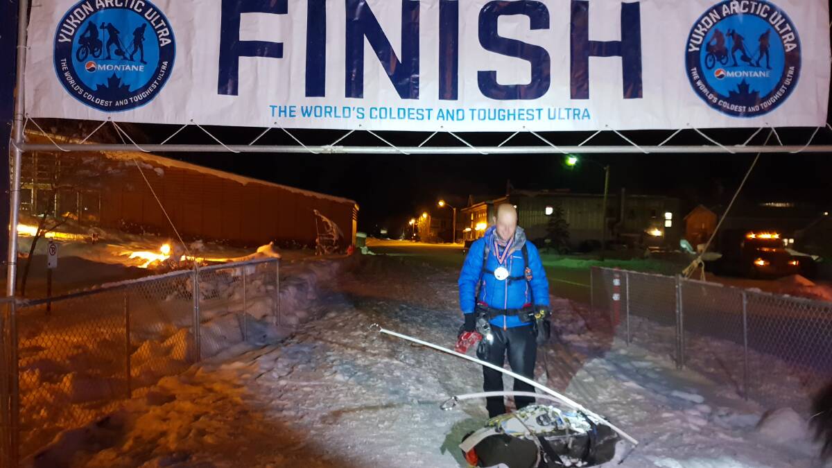RELIEF: After 11 days, nine hours and 53 minutes, Scott Thomson reaches the Yukon Arctic Ultra finish line. Picture: KATRINA PAWLEY
